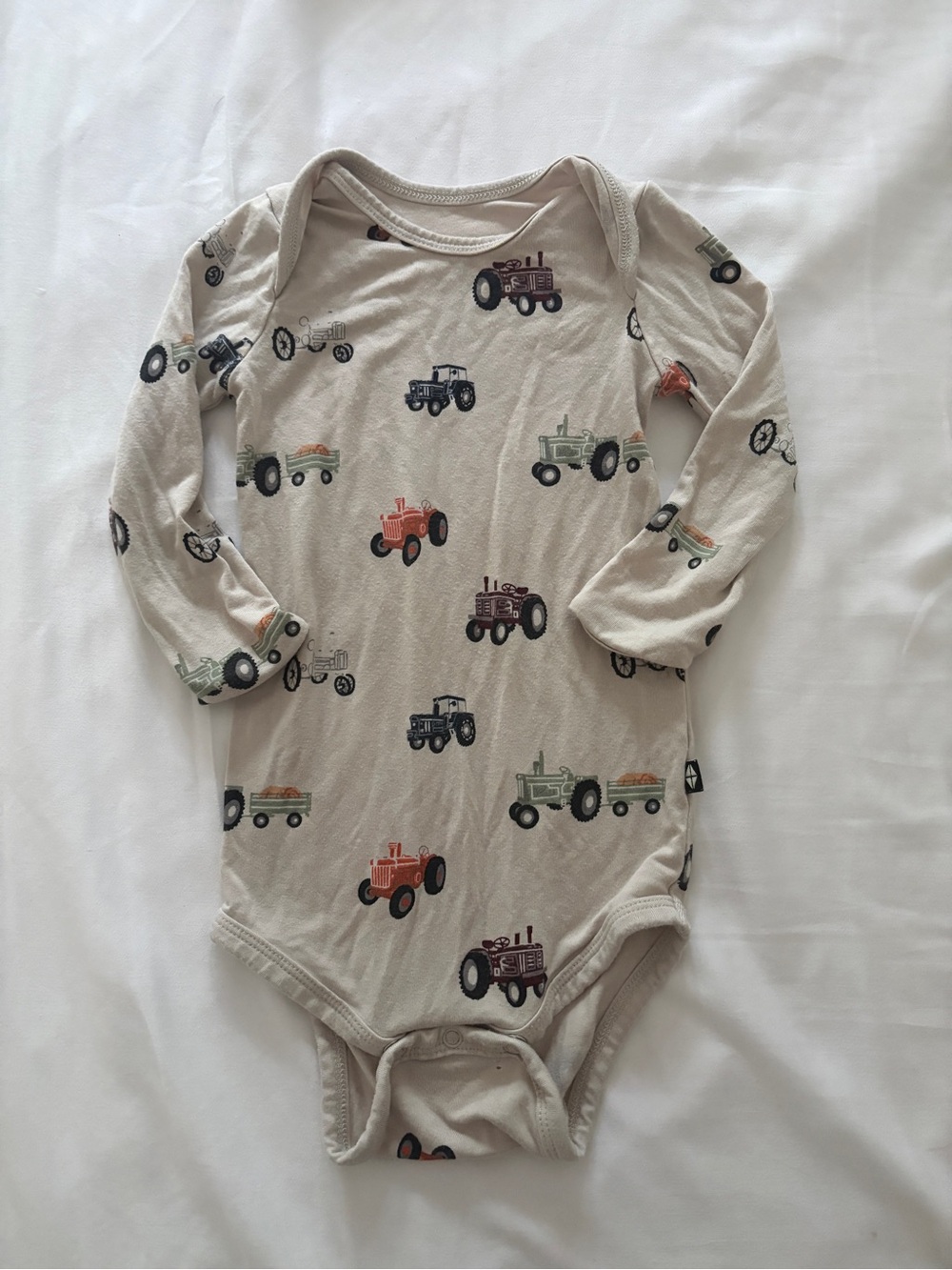 Kyte BABY Beige Long Sleeve Bodysuit with Tractor Print